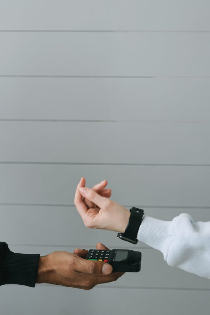 Person paying with smart watch