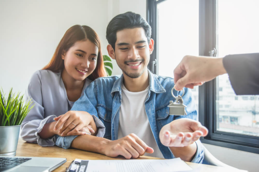 Couple getting keys to new home